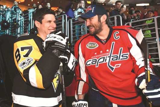 Pittsburgh Penguins captain Sidney Crosby (L) with Washington Capitals counterpart Alexander Ovechkin.