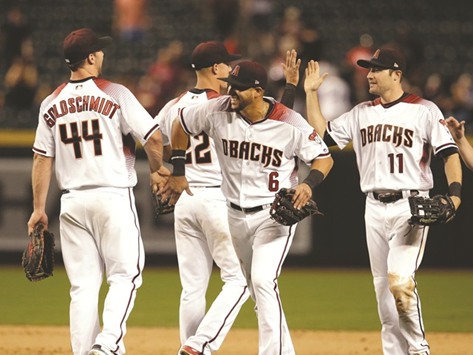 Arizona Diamondbacks right fielder David Peralta (No 6) celebrates with teammate Goldschmidt after their 7-6 victory over San Diego Padres at Chase Field. PICTURE: USA TODAY Sports