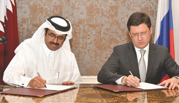HE the Minister of Energy and Industry Dr Mohamed bin Saleh al-Sada and Russian Energy Minister Alexander Novak signing an agreement during the third meeting of the Joint Qatar-Russian Commission on Trade, Economic and Technical Cooperation held yesterday.  PICTURE: Noushad Thekkayil