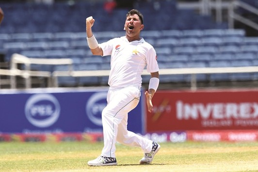 Pakistanu2019s Yasir Shah celebrates the wicket of West Indiesu2019 Alzarri Joseph on the final day of the first Test at Sabina Park in Kingston, Jamaica, yesterday. (AFP)
