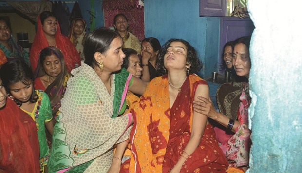 Relatives console a woman whose husband was one of the 25 CRPF men who died in an attack by Maoists, in Patna yesterday.