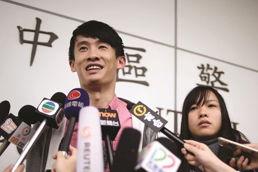 Hong Kong independence activists Yau Wai-ching (right) and Baggio Leung speak to the press after their release from Central police station in Hong Kong yesterday.