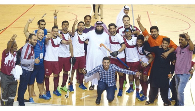 Qatar players and officials celebrate their victory over Malaysia in the menu2019s Indoor Asia Cup Hockey match at Aspire Dome yesterday. Hosts finished second in Pool A to advance to the last-four stage of the tournament and will face Kazakhstan in the semi-final today. PICTURE: Jayan Orma