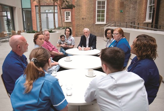 Labour leader Jeremy Corbyn attends a round table discussion with nurses, other medical staff and students during a general election campaign event in London yesterday.