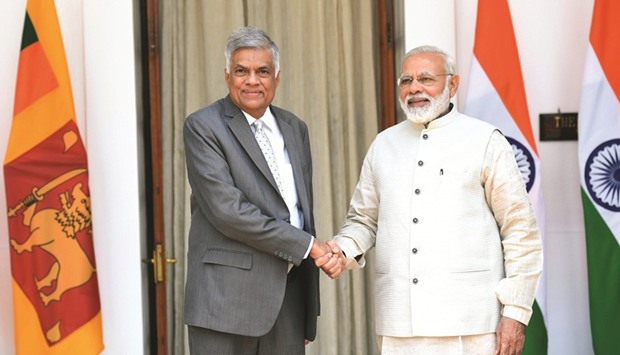 Indian Prime Minister Narendra Modi shakes hands with his Sri Lankan counterpart Ranil Wickremesinghe prior to a meeting in New Delhi yesterday.