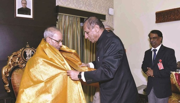President Pranab Mukherjee being felicitated by Telangana Governor E S L Narasimhan in Hyderabad yesterday.