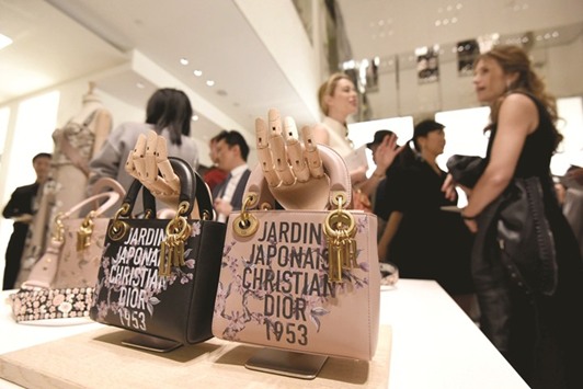 Guests at a preview of French fashion brand Christian Dioru2019s new shop at the Ginza shopping district in Tokyo. Japan logs some $22.7bn in annual spending on top-end goods made by brands including Chanel, Dior, and Prada, ranking it as the worldu2019s number two luxury market behind the US.