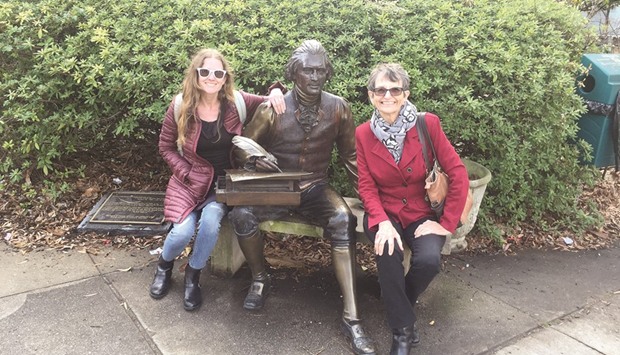The authoru2019s sister, Jennifer Stillman, and mom, Juliet Roberts, pose beside a sculpture of Thomas Jefferson by the artist George Lundeen. This statue sits near the courthouse in the Decatur square in Atlanta.