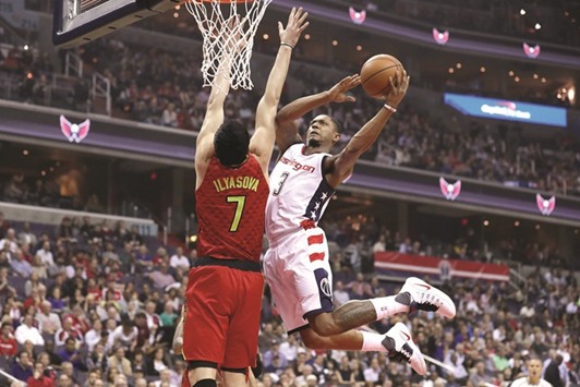 Bradley Beal (R) of the Washington Wizards puts up a shot in front of Ersan Ilyasova of the Atlanta Hawks during Game Five of the Eastern Conference quarter-finals.