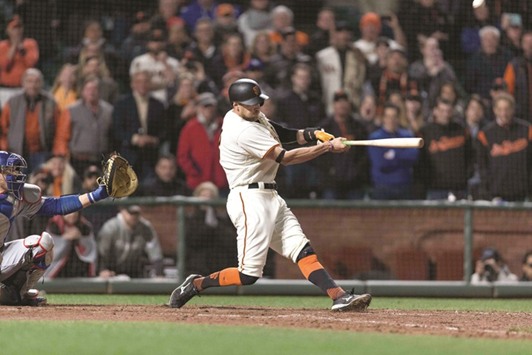 San Francisco Giants right fielder Hunter Pence hits a game winning sacrifice fly ball with the bases loaded during the tenth inning.