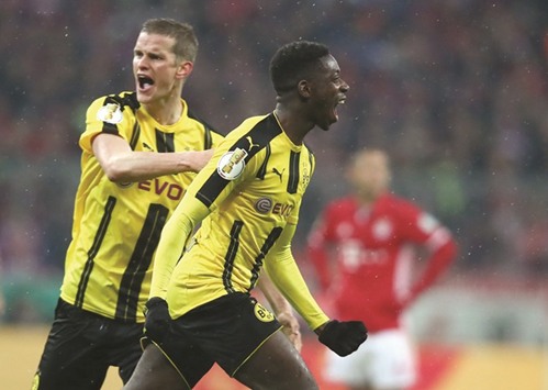 Borussia Dortmundu2019s Ousmane Dembele celebrates scoring their third goal.
