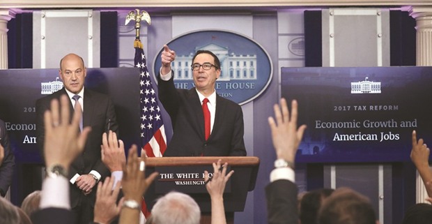 US National Economic Director Gary Cohn (left) and Treasury Secretary Steven Mnuchin unveil the Trump administrationu2019s tax reform proposal in Washington on Wednesday. The plan provided much for multinational corporations to rejoice over u2013 it calls for slashing the corporate income tax rate to 15% from 35% and applying a one-time, low rate to an estimated $2.6tn in offshore profits that have so far avoided US taxes.