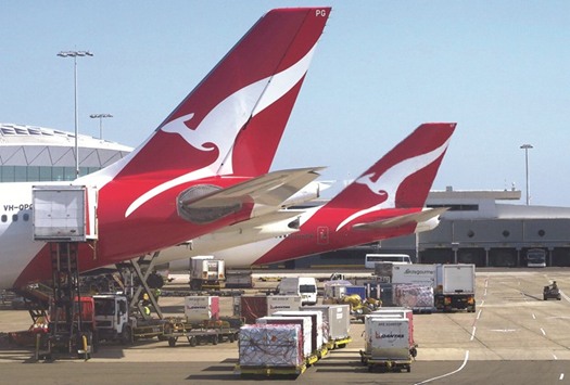 Qantas Airways aircraft at Sydney Airport. The airline yesterday said it would axe its Melbourne-Dubai-London flights operated in partnership with Emirates and switch the capacity to Asia.