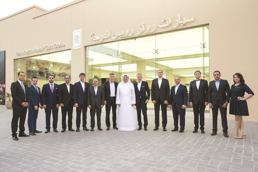Dignitaries from Rolls-Royce Motor Cars are seen with Omar Alfardan and officials of Rolls-Royce Motor Cars Doha.