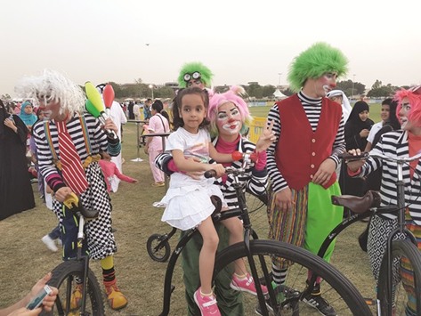 Roving clowns entertain children at Aspire Park. PICTURE: Joey Aguilar