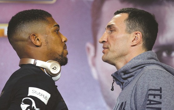Anthony Joshua and Wladimir Klitschko pose during their press conference in London yesterday.