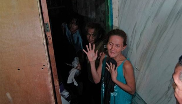 People are allegedly kept inside a hidden room at a police station in Manila. 