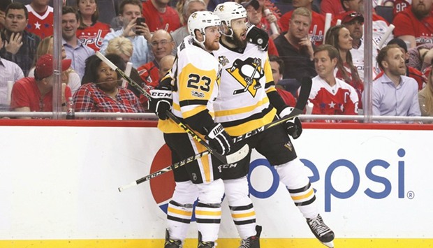 Nick Bonino (R) of the Pittsburgh Penguins celebrates a goal.
