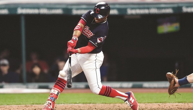 Cleveland Indians shortstop Francisco Lindor (12) hits a two run home run during the seventh inning against the Houston Astros.