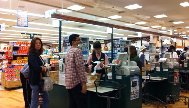 Shoppers at a supermarket in Tokyo. Japanu2019s household spending fell 1.3% in March from a year ago, the 13th consecutive monthly drop, and output at the nationu2019s factories shrank by 2.1%.