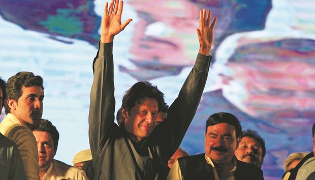Imran Khan, chairman of the Pakistan Tehreek-e-Insaf (PTI), waves to supporters during an anti-government protest in Islamabad yesterday.