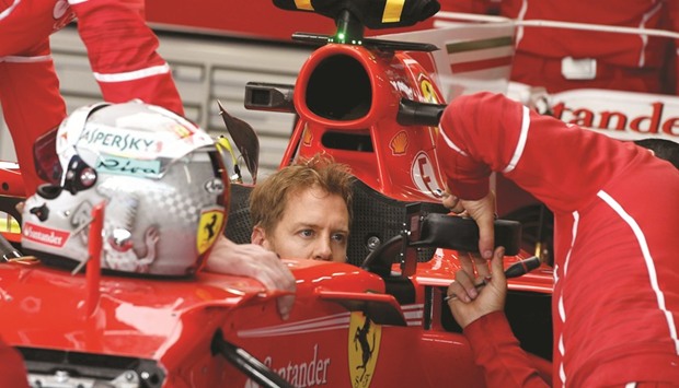 Ferrari driver Sebastian Vettel sits in his car in the garage at the Sochi Autodrom circuit ahead of Sundayu2019s Russian Grand Prix. (AFP)