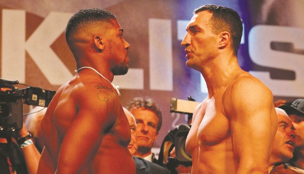FACE OFF: Joshua (L) and Klitschko pose at yesterdayu2019s weigh-in in London.