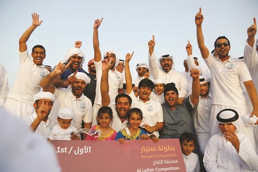 First place winners in Al-Laffah category celebrating at the award ceremony at Katara yesterday.