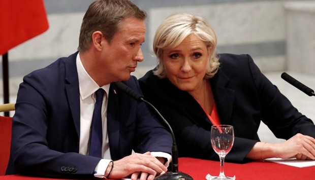 Marine Le Pen and Nicolas Dupont-Aignan (L) attend a news conference in Paris, France