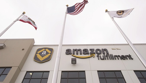 Amazon.com signage is displayed on the facade of the companyu2019s fulfilment centre in California. Amazonu2019s ventures far beyond online retail, from cloud computing to movie making, are raising questions among corporate strategy experts about its focus.