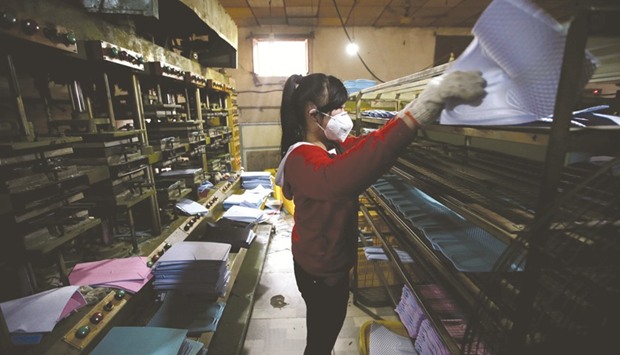 A woman works at Tongfa shoe factory in Santai town of Anxin county, one part of the new special economic zone Xiongan New Area. Chinau2019s plan to build a new city, about two hours drive from Beijing, has raised hopes it may catalyse better urban design across the nation, enhancing economic efficiency and cutting air pollution.