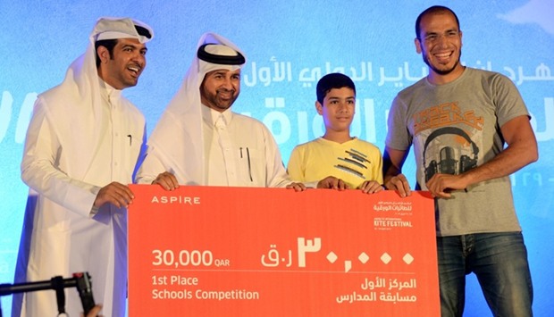 Dr Khalid bin Ibrahim al-Sulaiti (second, left) awards Muaz bin Jabal School for winning the inter-school competition. PICTURE: Thajudeen