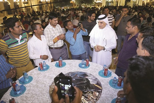 Al-Emadi with the workers at the ceremony.