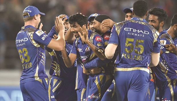 Mumbai Indiansu2019 Jasprit Bumrah (third from left) celebrates with teammates the victory in super over over Gujarat Lions in their Indian Premier League match in Rajkot yesterday. (AFP)