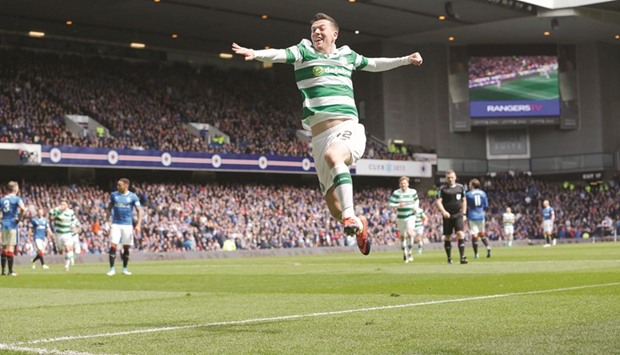 Celticu2019s Callum McGregor celebrates scoring their third goal.