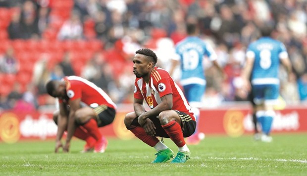 Sunderlandu2019s Jermain Defoe and Victor Anichebe look dejected after losing their EPL match against Bournemouth yesterday. (Inset) Sunderland manager David Moyes.