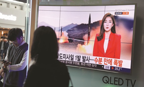 People watch news about the failed missile test of the Democratic Peopleu2019s Republic of Korea at a train station in Seoul yesterday.