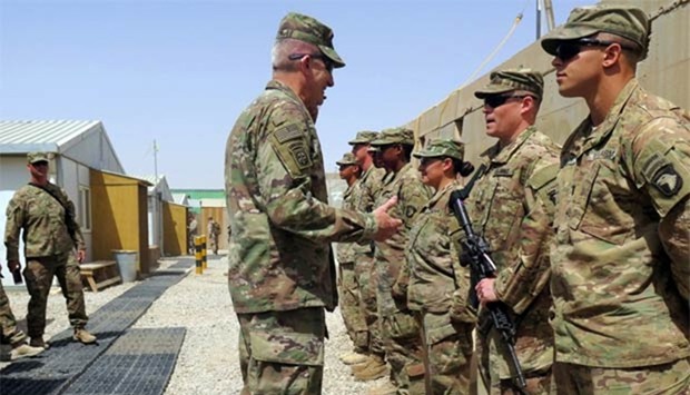 US Army General John Nicholson, commander of Resolute Support forces and US forces in Afghanistan, talks to US soldiers during a transfer of authority ceremony at Shorab camp in Helmand province on Saturday.