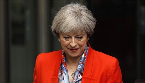 Britain's Prime Minister Theresa May leaves the BBC in London on Sunday.