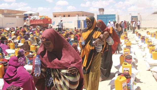Drought affected families in Somalia arriving to receive assistance provided by QC.