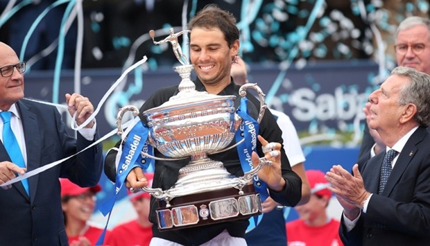 Rafael Nadal raises up the trophy.