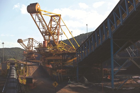 Crushed iron ore fills cargo train wagons aside a conveyor belt at Valeu2019s iron ore mine in Brazil. Top iron ore miners including Vale are bringing on new capacity, bolstering seaborne sales, at the same time that miners in China have been reviving production.