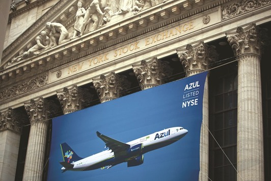 Azul signage is displayed outside of the New York Stock Exchange during the companyu2019s initial public offering. Azul sold shares last month with demand outpacing the amount offered. Azul jumped as much as 9.4% in its trading debut on April 11 after pulling off an initial public offering that had been delayed several times.