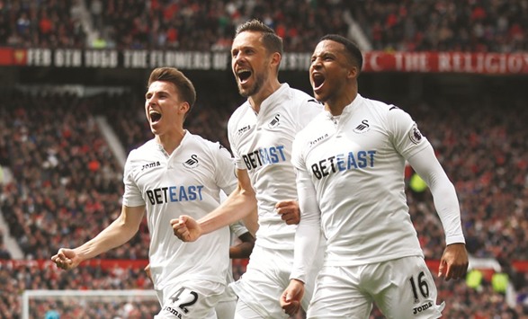 Swansea Cityu2019s Gylfi Sigurdsson (C) celebrates after scoring.