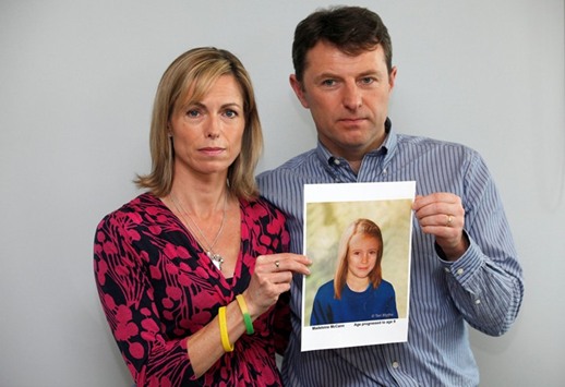 FILE PHOTO - Kate and Gerry McCann pose with a computer generated image of how their missing daughter Madeleine might look now, during a news conference in London.