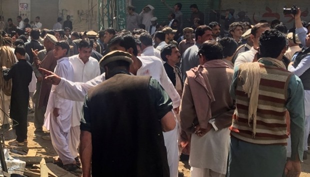 Residents gather near the site