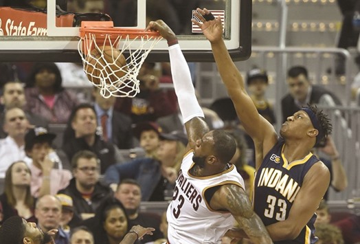 Cleveland Cavaliers forward LeBron James (No 23) dunks against Indiana Pacers centre Myles Turner (No 33) in the second quarter at Quicken Loans Arena. PICTURE: USA TODAY Sports
