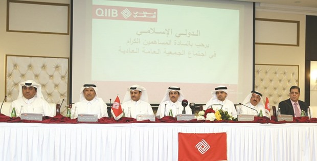 Sheikh Dr Khalid, Sheikh Abdullah and al-Shaibei among other QIIB directors  at the banku2019s annual general assembly at the Ezdan Tower yesterday.  PICTURE: Jayan Orma