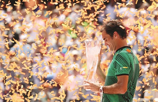 Roger Federer with the winneru2019s trophy at the Miami Open.