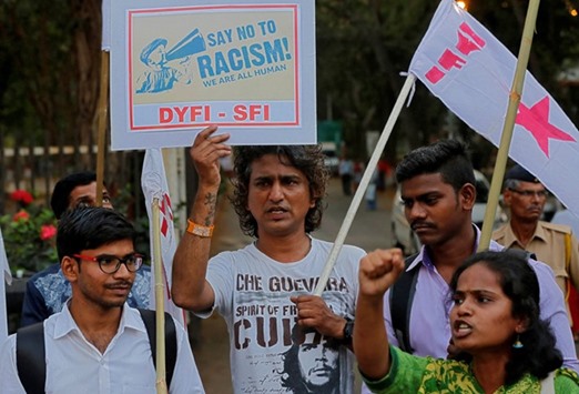 Demonstrators in Mumbai shout slogans as they carry placards during a protest organised by the Democratic Youth Federation of India against the attacks on Nigerian students in a Delhi suburb.